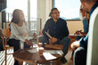 © Flamingo Images - Diverse office colleagues laughing together during a meeting