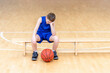 © Augustas Cetkauskas - Sad disappointed boy with basketball ball in a physical education lesson