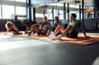 © Flamingo Images - Diverse people talking on a gym floor