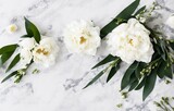 Fototapeta Kwiaty - Wedding floral still life composition. Bouquet of white peony flowers, olive branches on marble table with silk cloth and ribbon. Vintage feminine photo, flat lay, top view, no people, generative ai