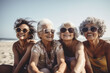 Elderly people enjoy company on sunny summer beach