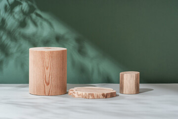 Podium natural wood material on a natural dry autumn leaf in the shade of a green background. Beauty cosmetic wooden display. Layout for exhibitions, products, cosmetics, health.