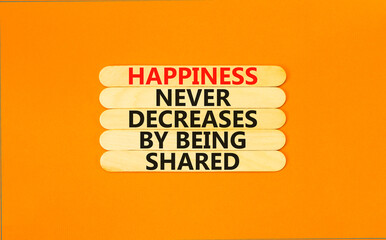 Wall Mural - Happiness symbol. Concept words Happiness never decreases by being shared on wooden stick. Beautiful orange table orange background. Motivational Happiness concept. Copy space.