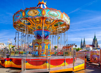 Wall Mural - Munich, Germany - May 7: typical chain carousel and decoration at the annual spring festival (Frühlingsfest) in Munich on May 7, 2023