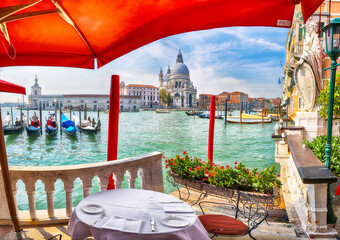 Fabulous morning cityscape of Venice with famous Canal Grande and Basilica di Santa Maria della Salute church.