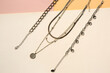 © Pixel-Shot - Beautiful necklaces and bracelets on color background