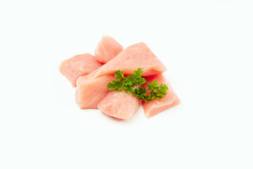 Wall Mural - Raw pieces of turkey meat with greens on a white background.Fresh pieces of turkey meat on a white background.Raw chicken. chicken fillet.Ogranic food and healthy eating.turkey or poultry meat.