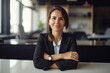 © Banana Images - Business woman, arms crossed, portrait and smile at desk in office for paperwork, laptop or administration. Happy, confident female at table in startup company, defocused bokeh, flare