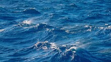 Slow Motion Ocean Spray Mist Blown Off Peaks Of Large Rough Wave In Ocean