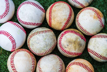 Collection Of Used Baseballs On The Ground For Sports Background