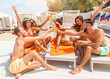 © alphaspirit - Group of friends with swimsuit drink a cocktail in a beach place