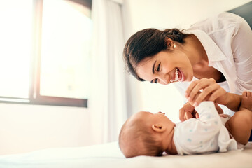 Poster - Happy, love and a mother with her baby in the bedroom of their home together for playful bonding. Family, children and a young mama spending time with her newborn infant on the bed for fun or joy