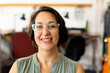 © Wavebreak Media - Portrait of happy caucasian female worker looking at camera and smiling at jewellery workshop