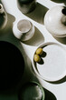 Two Green Olives on a ceramic pottery dish in the studio