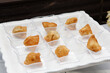 A view of a catered platter of mini samosas.