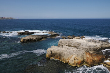 Wall Mural - sea on ortigia syracuse old buildings street view Sicily on sunny day