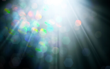 Wall Mural - rays of light with colorful bokeh on black background. abstract background.