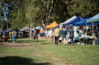 © William - Weekend country market in a park in Australia. Family’s and people at a Farmers market selling fruit and vegetables