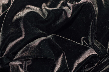 Wall Mural - Texture of black velor corduroy fabric with folds.