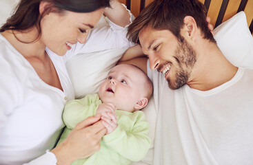 Canvas Print - Top view of happy family, parents and baby in bedroom for love, care and quality time together at home. Mother, father and newborn kid relax on bed with support, childhood development and happiness