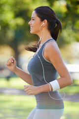 Sticker - Sports, earphones and athlete running in a park for health, wellness and outdoor exercise. Nature, fitness and female runner doing cardio workout in garden listening to music or radio and training.