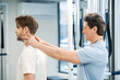 © zinkevych - Manual therapist working with a patient in rehabilitation center
