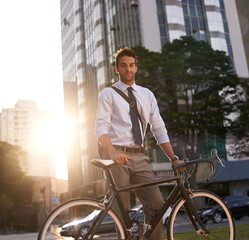 Wall Mural - Cycling, portrait and business man in city for commute, carbon neutral and transportation. Sustainable, professional and travel with male employee walking with bike in urban town for journey and trip