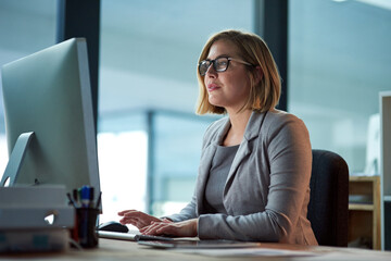 Poster - Computer, typing and business woman in office working late on project at night alone. Desktop, professional and female person writing email, report or planning, reading and overtime for deadline.