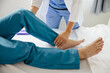 © Witoon - Physiotherapist working with patients in clinic,