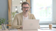 © stockbakers - Smiling Young Businessman with Headset in Call Center