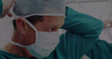 Wall Mural - Animation of heart rate monitor against caucasian male surgeon wearing surgical mask at hospital