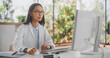 © Gorodenkoff - Portrait of an Asian Medical Health Care Professional Working on Desktop Computer in Hospital Office. Female Clinic Physician Appointing Prescriptions Online, Updating Electronic Health Records