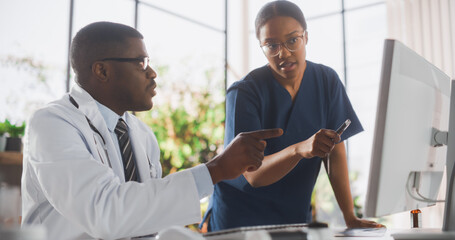 Wall Mural - Doctor's Office: Physician Talks With Professional Head Nurse, Using Computer. African Medical Health Care Specialists Discussing Test Results, Prescription Medicine, Patient Treatment