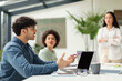 © Prostock-studio - Arabic Guy At Laptop Talking To Colleagues Women In Office