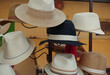 Various hats  in the window of a hatshop in France.
