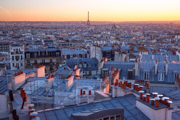 Wall Mural - Aerial panoramic view from Montmartre over Paris roofs at nice pink sunrise, Paris, France