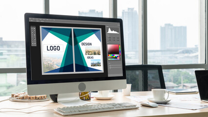 Graphic designer software for modern design of web page and commercial ads showing on the computer screen
