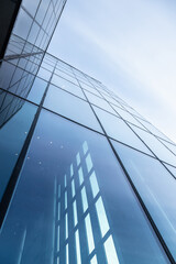 Canvas Print - glass office building exterior against the sky