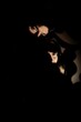 © Vladimir Tsarkov/Stocksy - Loving couple hugging in darkness
