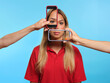 © French Anderson Ltd/Stocksy - Young female with phone screens