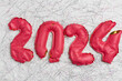 © Alison Winterroth/Stocksy - End of 2024 concept deflated balloons