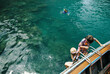 © Tanya Yatsenko/Stocksy - Father with kids snorkelling in the sea