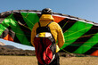 © Valentina Barreto/Stocksy - man during parachute landing practice