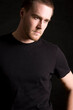 © Designpics - young man portrait on black background