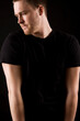 © Designpics - young man portrait on black background