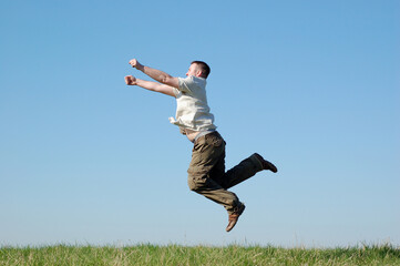 Wall Mural - happy man on sky background