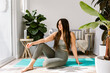 © ByLorena/Stocksy - Wellness woman prepared to do yoga at home