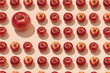 Many different scattered apples isolated on a beige background