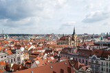 Fototapeta Sypialnia - Aerial panoramic view of Prague against a cloudy sky.