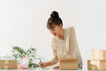 Beautiful Asian Woman With Parcel ,online Seller Concept.